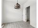 Dining room with decorative light fixture and wood floors at 15034 Scoter St, Charlotte, NC 28262