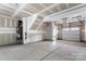 Spacious unfinished garage with a concrete floor, perfect for storage or future customization at 15034 Scoter St, Charlotte, NC 28262