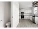 Kitchen with white cabinets and black appliances at 15034 Scoter St, Charlotte, NC 28262
