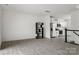 Bright living room featuring an open-concept layout with modern flooring and kitchen view at 15034 Scoter St, Charlotte, NC 28262