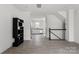 Open-concept living room showcasing modern flooring, view of the kitchen, and staircase at 15034 Scoter St, Charlotte, NC 28262