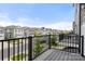 Balcony with street view of well-maintained homes with manicured lawns in a desirable neighborhood at 15034 Scoter St, Charlotte, NC 28262