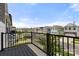 Balcony view overlooking the street lined with charming two-story homes in a friendly neighborhood at 15034 Scoter St, Charlotte, NC 28262