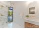Stylish bathroom featuring a glass shower, marble countertops, and sleek fixtures at 15037 June Washam Rd, Davidson, NC 28036