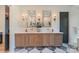 Bathroom with double sinks, marble counters, and wooden cabinets at 15037 June Washam Rd, Davidson, NC 28036
