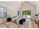 Bright bedroom with vaulted ceiling features modern lighting and access to outdoor patio at 15037 June Washam Rd, Davidson, NC 28036
