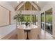 Bright dining room with vaulted ceilings, natural light, and beautiful backyard views at 15037 June Washam Rd, Davidson, NC 28036