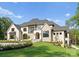Stunning new construction home with stone and painted brick exterior and professionally landscaped yard at 15037 June Washam Rd, Davidson, NC 28036