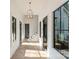 Bright hallway with hardwood floors and large windows provides ample natural light at 15037 June Washam Rd, Davidson, NC 28036