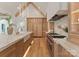 This gourmet kitchen features stone countertops, custom cabinets, and professional-grade appliances at 15037 June Washam Rd, Davidson, NC 28036