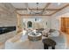 Inviting living room featuring a stone fireplace, coffered ceilings, and an open floor plan at 15037 June Washam Rd, Davidson, NC 28036