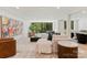 Spacious living room with large windows, plush seating, and stylish decor for a comfortable and inviting atmosphere at 15037 June Washam Rd, Davidson, NC 28036