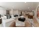 Open concept living room featuring plush seating, stylish decor, and ample space for entertaining and relaxation at 15037 June Washam Rd, Davidson, NC 28036