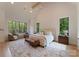 Beautiful main bedroom with vaulted ceilings, hardwood floors, and backyard views at 15037 June Washam Rd, Davidson, NC 28036