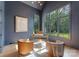 Stylish home office with large windows, hardwood floors, designer lighting, and sophisticated decor at 15037 June Washam Rd, Davidson, NC 28036