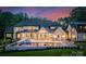 Elegant backyard featuring a pool with a fountain, an outdoor kitchen, and outdoor seating at 15037 June Washam Rd, Davidson, NC 28036