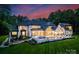 Luxury backyard featuring a pool with a fountain, outdoor seating, and manicured landscaping at 15037 June Washam Rd, Davidson, NC 28036