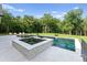 Gorgeous backyard pool with hot tub, stone accents, and beautiful landscaping at 15037 June Washam Rd, Davidson, NC 28036