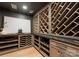 Elegant wine cellar featuring custom wood racking, granite countertops, and stylish displays for wine storage at 15037 June Washam Rd, Davidson, NC 28036
