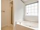 Elegant bathroom with a relaxing soaking tub and a separate shower enclosure at 1520 Deer Forest Dr, Fort Mill, SC 29707