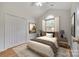 This bedroom offers a comfortable setting with a neutral color palette and a large window for ample natural light at 1520 Deer Forest Dr, Fort Mill, SC 29707