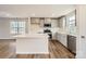 Modern kitchen with stainless steel appliances, a center island, and bright white cabinets at 1530 Cottage Creek Dr, Bessemer City, NC 28016