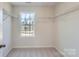 Walk-in closet featuring built-in shelving and a bright window for ample natural light at 1530 Cottage Creek Dr, Bessemer City, NC 28016