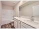 Bright bathroom featuring double sink vanity, full tub and shower combo, and wood-look flooring at 1547 Cottage Creek Dr, Bessemer City, NC 28016