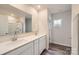 Bathroom featuring double sink vanity with modern fixtures, large mirror, and shower at 1547 Cottage Creek Dr, Bessemer City, NC 28016
