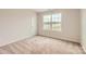 Bedroom with neutral carpet, a window offering natural light, and a closet at 1547 Cottage Creek Dr, Bessemer City, NC 28016