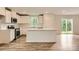 Well-equipped kitchen boasting white cabinets, stainless steel appliances, and center island with sink at 1547 Cottage Creek Dr, Bessemer City, NC 28016