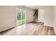 Bright living room featuring sliding glass doors to the backyard and access to the stairs at 1547 Cottage Creek Dr, Bessemer City, NC 28016