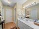Clean bathroom featuring white cabinetry, countertop and large vanity mirror at 1634 - B Union Rd, Gastonia, NC 28054