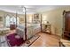 Inviting bedroom featuring a four-poster bed, decorative accents, and ample natural light at 1634 - B Union Rd, Gastonia, NC 28054