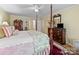 Well-lit bedroom featuring a four-poster bed, antique furnishings, and a tranquil setting at 1634 - B Union Rd, Gastonia, NC 28054