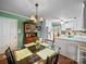 Cozy dining area with a glass table, chandelier, and access to the kitchen, great for casual meals at 1634 - B Union Rd, Gastonia, NC 28054