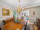Elegant dining room featuring a wooden table, chandelier, and seamless access to the living room at 1634 - B Union Rd, Gastonia, NC 28054