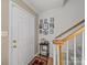 Welcoming entryway with a white door, wooden floors, and a staircase leading to the upper level of the home at 1634 - B Union Rd, Gastonia, NC 28054