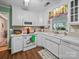 Well-lit kitchen featuring white cabinets, laminate countertops, and modern appliances, perfect for home cooking at 1634 - B Union Rd, Gastonia, NC 28054