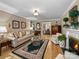 Bright living room with hardwood floors, fireplace and a view to a dining area, perfect for entertaining at 1634 - B Union Rd, Gastonia, NC 28054