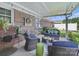Cozy covered patio featuring comfortable seating, brick accents, string lights, and views of a landscaped yard at 1634 - B Union Rd, Gastonia, NC 28054