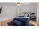 Comfortable bedroom with a modern accent light and plush bedding for a relaxing retreat at 2121 Laburnum Ave, Charlotte, NC 28205