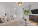 Bright and spacious bedroom with hardwood floors, an ensuite bathroom, and a large window at 2121 Laburnum Ave, Charlotte, NC 28205