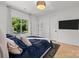 Comfortable bedroom with a large window providing natural light and a view of the outdoors at 2121 Laburnum Ave, Charlotte, NC 28205