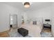 Inviting bedroom featuring hardwood floors, modern decor, and a decorative mirror at 2121 Laburnum Ave, Charlotte, NC 28205