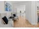 Upstairs hallway with seating area, hardwood floors and elegant trim at 2121 Laburnum Ave, Charlotte, NC 28205