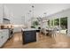 Spacious kitchen with a center island, stainless steel appliances, and an adjacent dining area at 2121 Laburnum Ave, Charlotte, NC 28205