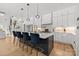 Bright kitchen with a marble island, pendant lighting, stainless appliances and seating for four at 2121 Laburnum Ave, Charlotte, NC 28205