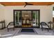 Outdoor patio featuring a large sliding door, patio furniture and backyard access, perfect for entertaining at 2121 Laburnum Ave, Charlotte, NC 28205