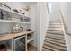 Staircase and coffee bar that features wooden stairs and a wine cooler at 2121 Laburnum Ave, Charlotte, NC 28205